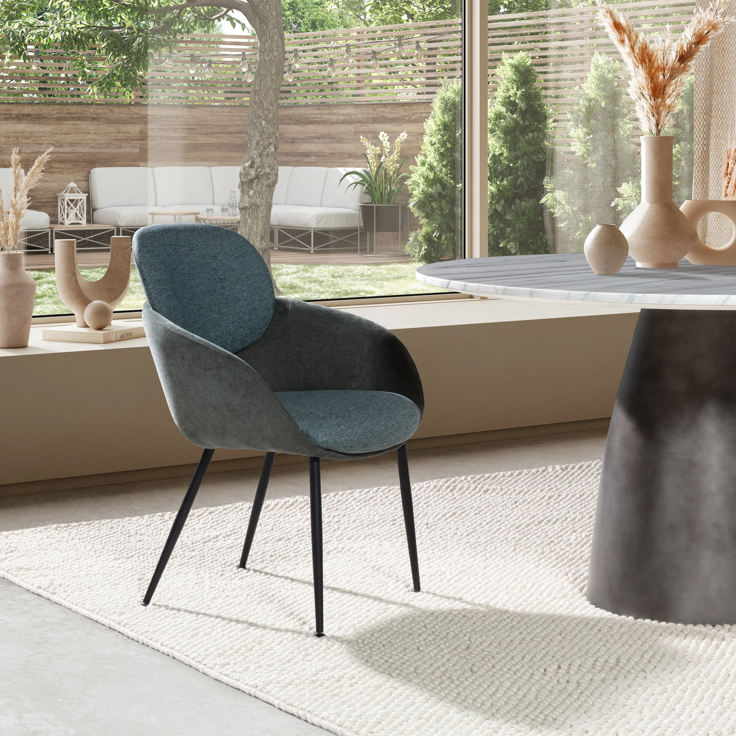 Sillón Nure Verde Bosque tapizado con respaldo redondeado, reposabrazos y patas metálicas negras
